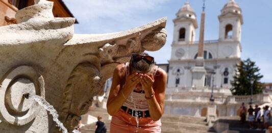 Tourists Struggle With The Heat As Temperatures Soar In Rome