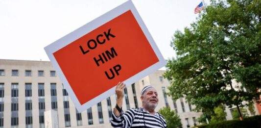 People Gather In Front Of The E. Barrett Prettyman Federal Courthouse Ahead Of Donald Trump's Arraignment In Washington