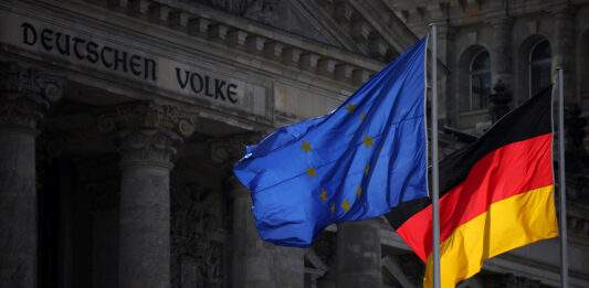 File Photo: The Flags Of Eu And Germany Fly In Front Of Reichstag Building In Berlin