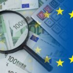 Business,Concept,,Calculator,And,Magnifying,Glass,On,Euro,Banknotes